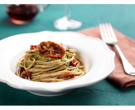 Whole wheat spaghetti with basil pesto and dried tomatoes