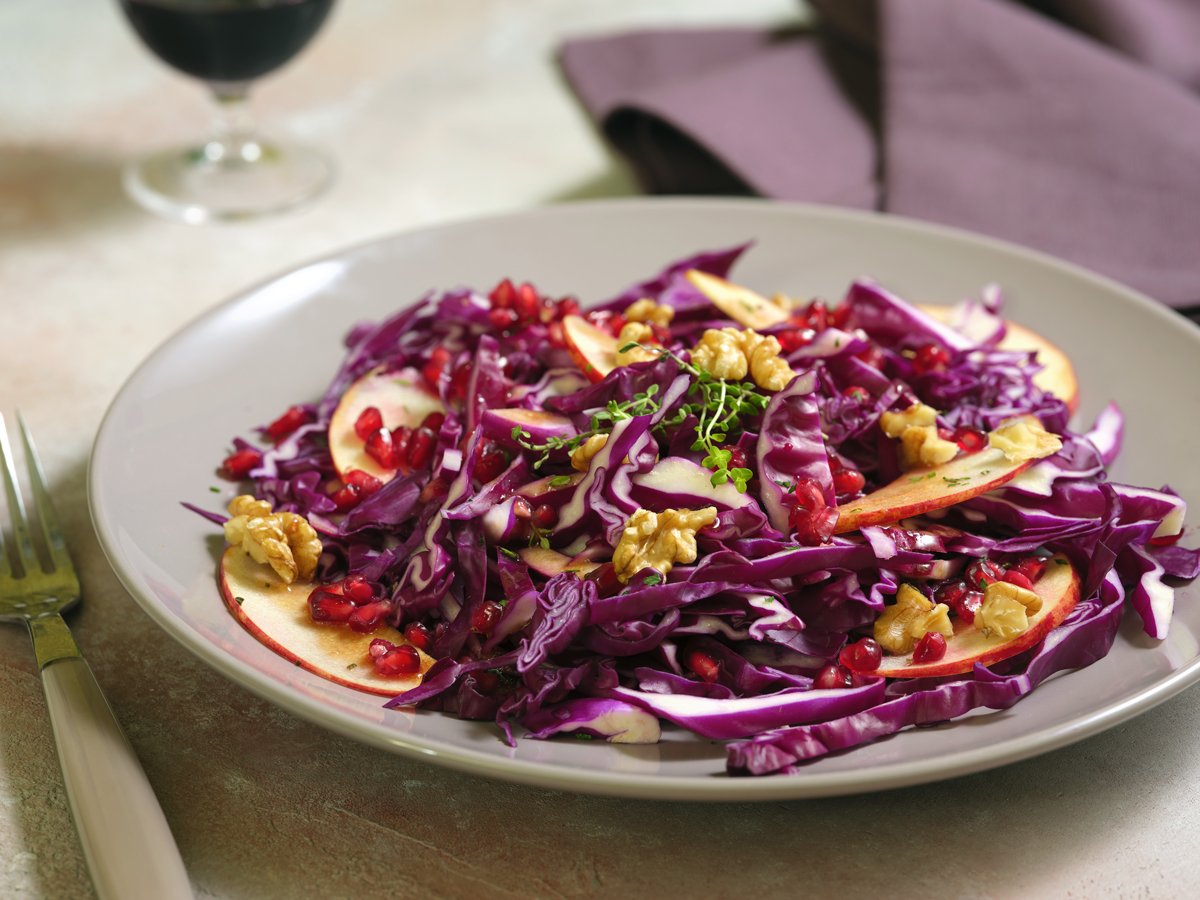 Purple cabbage, apple, pomegranate and walnuts salad